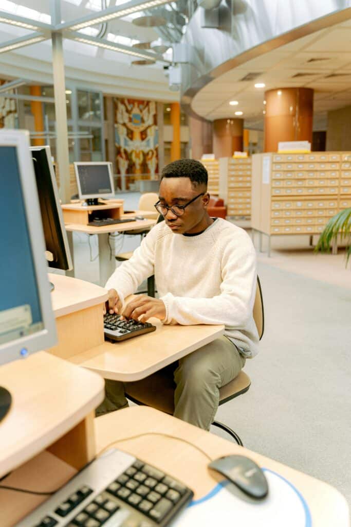 Man Using a Computer at the Library